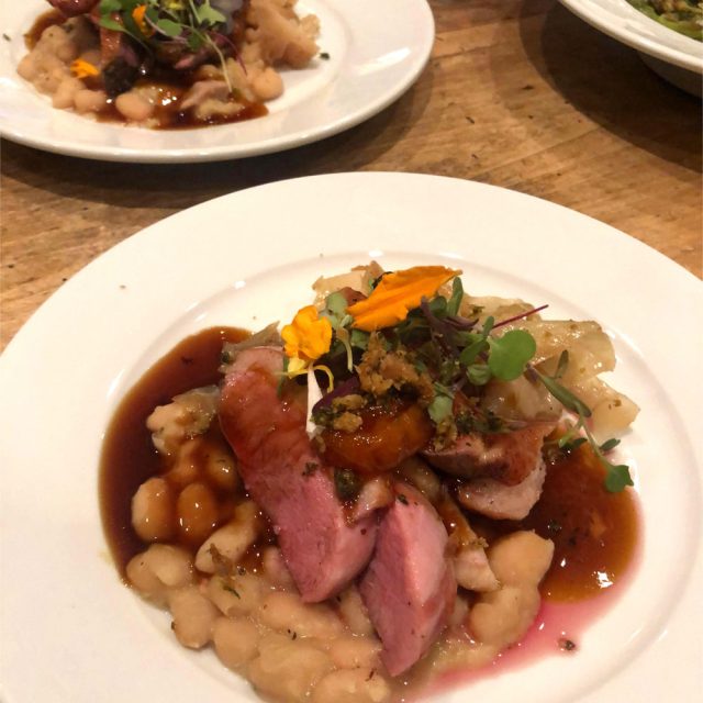 Braised Duck over White Beans